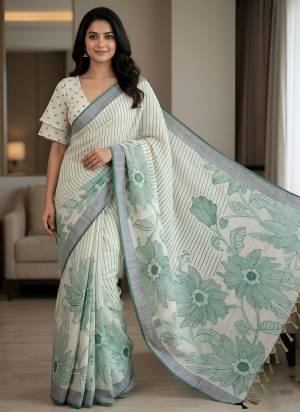 Looking These Party Wear Saree in Fine Colored.These Saree Are Linen And Blouse is Fabricated On Linen.Its Beautified With Woven Border Designer With Floral Printed.