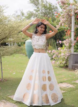 Looking These Beautiful Looking Navratri Wear Free Size Stitched Lahenga Choli.These Lahenga Are Roman Silk And Blouse is Fabricated On Roman Silk.Its Beautified With Designer Mirror Lace And Round Gota Work.