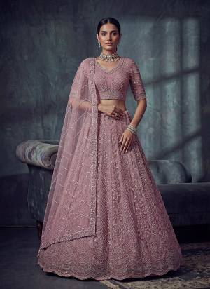 For A Fancy Designer Look,Grab These Lehenga Choli With Dupatta in Fine Colored.These Lehenga And Choli Are Net And Dupatta Are Fabricated On Soft Net Pair.Its Beautified With Fancy Patten,Jari,Sequance,Kasab,Thread Embroidery,Motif Work. 