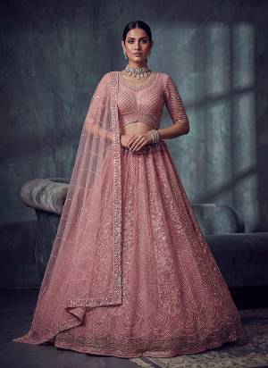 For A Fancy Designer Look,Grab These Lehenga Choli With Dupatta in Fine Colored.These Lehenga And Choli Are Net And Dupatta Are Fabricated On Soft Net Pair.Its Beautified With Fancy Patten,Jari,Sequance,Kasab,Thread Embroidery,Motif Work. 