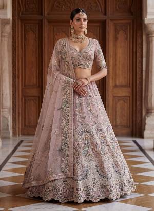 For A Fancy Designer Look,Grab These Lehenga Choli With Dupatta in Fine Colored.These Lehenga And Choli Are Net And Dupatta Are Fabricated On Soft Net Pair.Its Beautified With Fancy Patten Peacock Jari,Dori,Thread Embroidery,Diamond Work. 