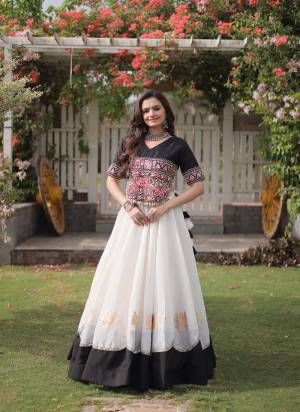 Looking These Beautiful Looking Navratri Wear Free Size Stitched Lahenga Top.These Lahenga Are Roman And Blouse Top is Fabricated On Roman.Its Beautified With Designer Kutchi Gamti Embroidery,Gota Lotus Flower, Mirror Lace Work.
