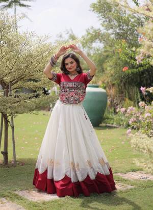 Looking These Beautiful Looking Navratri Wear Free Size Stitched Lahenga Top.These Lahenga Are Roman And Blouse Top is Fabricated On Roman.Its Beautified With Designer Kutchi Gamti Embroidery,Gota Lotus Flower, Mirror Lace Work.