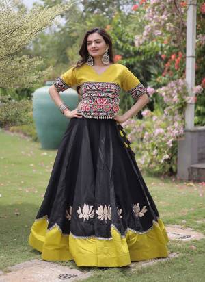 Looking These Beautiful Looking Navratri Wear Free Size Stitched Lahenga Top.These Lahenga Are Roman And Blouse Top is Fabricated On Roman.Its Beautified With Designer Kutchi Gamti Embroidery,Gota Lotus Flower, Mirror Lace Work.