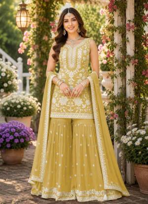 Garb These Party Wear Sharara Suit in Fine Colored Pair Sharara With Dupatta.These Top,Bottom And Dupatta Are Chiffon Fabricated.Its Beautified With Designer Heavy Sequance Embroidery,Khatli Work.
