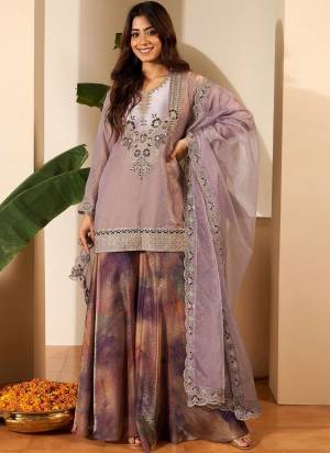 Garb These Suit in Fine Colored Pair With Bottom And Dupatta.These Top Are Fendy Satin And Bottom Are Fabricated On Jimmy Choo Pair With Organza Dupatta.Its Beautified With Designer Embroidery Work With Printed Bottom.