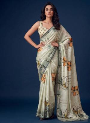 Looking These Party Wear Saree in Fine Colored.These Saree is Fabricated On Silver Silk Pair With Silver Silk Blouse.Its Beautified Designer Printed.