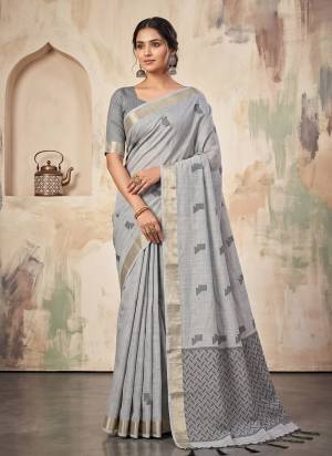 Garb These Fastive And Party Wear Saree in Fine Colored.These Saree And Blouse is Fabricated On Linen.Its Beautified With Woven Jari Border With Resham Designer.