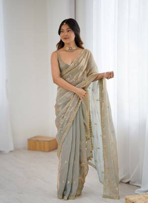 Attractive These Fancy Party Wear Saree in Fine Two Tone Colored.These Saree Are Fendy Satin And Blouse is Fendy Satin Fabricated.Its Beautified With Two Tone Color,Designer Jari,Sequance Embroidery Work.