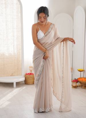 Attractive These Fancy Party Wear Saree in Fine Colored.These Saree Are NC Moss Chiffon And Blouse is Ultra Satin Fabricated.Its Beautified With Designer Sequance,Cut Dana Beads Work.