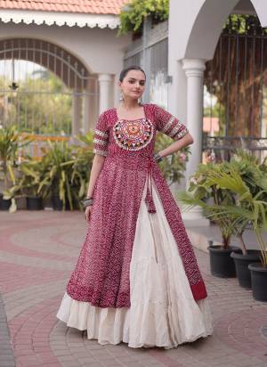 Garb These Navratri Wear Lehenga Kurti in Fine Colored. These Lehenga Are Kora Cotton And Kurti Are Faux Georgette Fabricated. It is Beautified With Designer Bandhani Printed With Kutchi Patch Work.