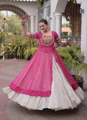 Garb These Navratri Wear Lehenga Kurti in Fine Colored. These Lehenga Are Kora Cotton And Kurti Are Faux Georgette Fabricated. It is Beautified With Designer Bandhani Printed With Kutchi Patch Work.