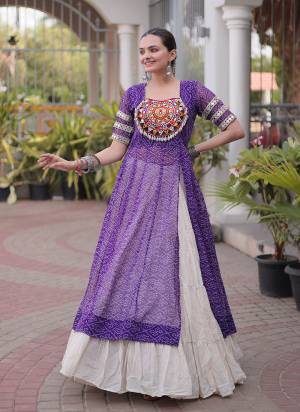 Garb These Navratri Wear Lehenga Kurti in Fine Colored. These Lehenga Are Kora Cotton And Kurti Are Faux Georgette Fabricated. It is Beautified With Designer Bandhani Printed With Kutchi Patch Work.