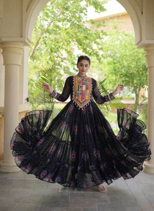 Garb These Beautiful Looking Navratri Readymade Long Gown.These Gown Are Faux Georgette Fabricated.Its Beautified With Bandhani Printed With Kutchi Patch Work.