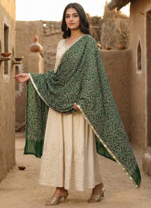 Grab These Beautiful Colored Ethnic Dupatta.This Dupatta is Fabricated On Beautiful Cotton Fabric . It Is Beautified With Beautiful Designer Ajarkh Dabbu Printed,Gold Patta Lace.