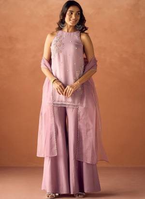 Garb These Suit in Fine Colored Pair With Bottom And Dupatta.These Top Are Crunchy And Bottom Are Fabricated On Roman Silk Pair With Organza Dupatta.Its Beautified With Designer Beads Embroidery Work.