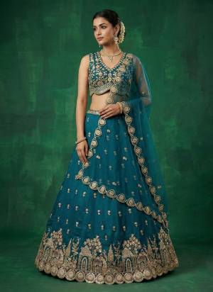Garb This Party Wear Fine Color Fancy Heavy Designer Choli And Lahenga Fabriced On Chinon Silk And Dupatta Net In Fabricated Beautified With Attrective Designer Sequance,Moti Embroidery Work. Buy Now.