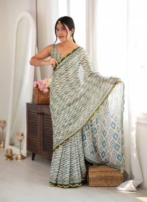 Looking These Party Wear Saree in Fine Colored.These Saree Are Chinon And Blouse is Chinon Fabricated.Its Beautified With Designer Digital Printed With Mirror Cut Work Border.