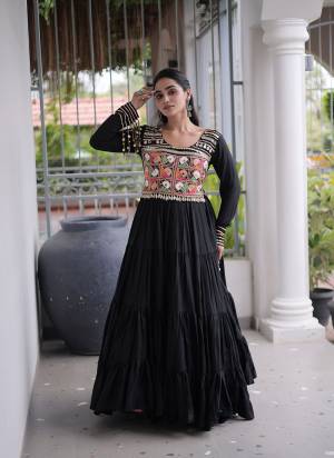 Garb These Beautiful Looking Navratri Readymade Long Gown.These Gown Are Rayon Fabricated.Its Beautified With Mirror,Kutchi Gamthi Embroidery Work.
