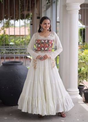 Garb These Beautiful Looking Navratri Readymade Long Gown.These Gown Are Rayon Fabricated.Its Beautified With Mirror,Kutchi Gamthi Embroidery Work.