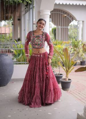 Looking These Navratri Wear Lehenga Choli in Fine Colored. These Lehenga Are Faux Georgette And Blouse Are Faux Georgette Fabricated. It is Beautified With Designer Bandhani Printed With Kutchi Patch Work.