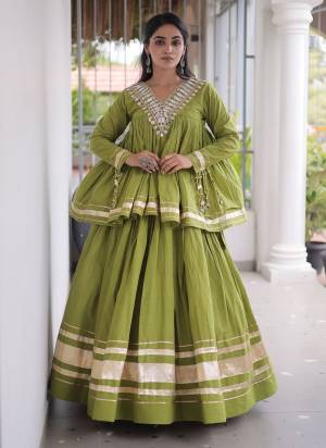 Garb These Beautiful Looking Navratri Wear Free Size Stitched Lahenga Choli.These Lahenga Are Kora Cotton And Blouse is Fabricated On Kora Cotton.Its Beautified With Designer Real Mirror,Jari Patta And Gotta Patti Lace Work.
