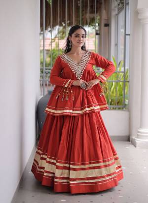 Garb These Beautiful Looking Navratri Wear Free Size Stitched Lahenga Choli.These Lahenga Are Kora Cotton And Blouse is Fabricated On Kora Cotton.Its Beautified With Designer Real Mirror,Jari Patta And Gotta Patti Lace Work.