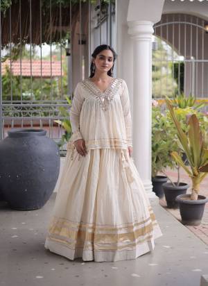 Garb These Beautiful Looking Navratri Wear Free Size Stitched Lahenga Choli.These Lahenga Are Kora Cotton And Blouse is Fabricated On Kora Cotton.Its Beautified With Designer Real Mirror,Jari Patta And Gotta Patti Lace Work.