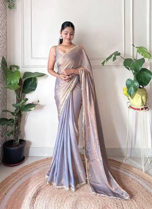 Attractive These Fancy Party Wear Saree in Fine Pedding Colored.These Saree Are Fendy Satin And Blouse is Fendy Satin Fabricated.Its Beautified With Two Tone Color,Sequance Hand Work Border Lace.