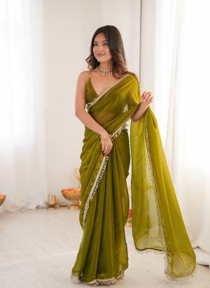 Attractive These Fancy Party Wear Saree in Fine Pedding Colored.These Saree Are Fendy Satin And Blouse is Fendy Satin Fabricated.Its Beautified With Two Tone Color,Sequance Hand Work Border Lace.