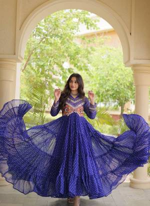 Garb These Beautiful Looking Navratri Readymade Long Gown.These Gown Are Faux Georgette Fabricated.Its Beautified With Bandhani Printed With Kutchi Patch Work.