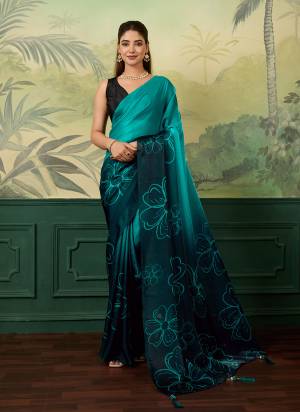 Garb This Party Wear Saree Paired With Blouse.This Saree And Blouse Are Satin Silk Fabric With Designer Digital Printed. Buy This Pretty Saree Now.