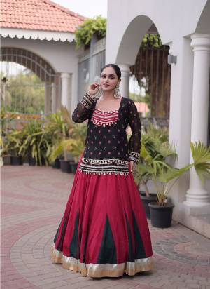 Looking These Navratri Wear Lehenga Choli With Jacket in Fine Colored. These Lehenga Are Rayon And Blouse Are Rayon Fabricated And Faux Georgette Jacket. It is Beautified With Designer Bandhani Printed With Kutchi Gamthi Lace Work.