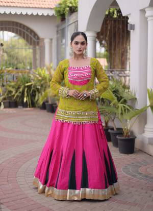 Looking These Navratri Wear Lehenga Choli With Jacket in Fine Colored. These Lehenga Are Rayon And Blouse Are Rayon Fabricated And Faux Georgette Jacket. It is Beautified With Designer Bandhani Printed With Kutchi Gamthi Lace Work.