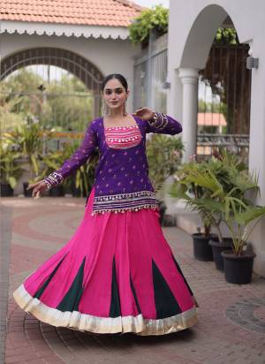 Looking These Navratri Wear Lehenga Choli With Jacket in Fine Colored. These Lehenga Are Rayon And Blouse Are Rayon Fabricated And Faux Georgette Jacket. It is Beautified With Designer Bandhani Printed With Kutchi Gamthi Lace Work.