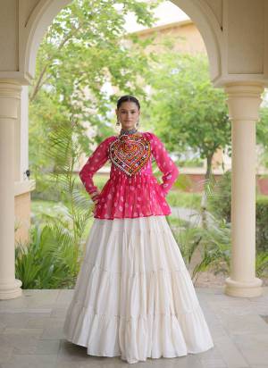Garb These Navratri Wear Lehenga Choli in Fine Colored. These Lehenga Are Kora Cotton And Blouse Are Faux Georgette Fabricated. It is Beautified With Designer Bandhani Printed With Kutchi Gamthi Patch Work.