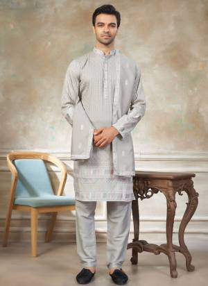 Looking These Party Wear Mans Wear Kutra Payjama With Dupatta wearing this fashionable. Tailored Kurta Are Silk And Payjama Silk And Silk Dupatta finest Fabriced With Designer Embroidery Work.