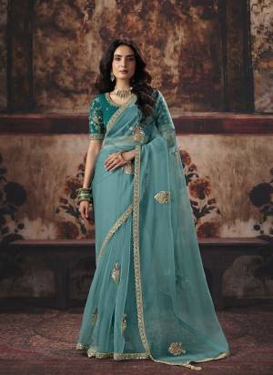 Looking These Fancy Party And Fastival Wear Saree in Fine Colored.These Saree Are Organza And Blouse is Fabricated On Benglori Silk.Its Beautified With DesignerMotif Crystal Beads,Sequance Hand Work.