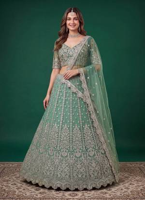 For A Designer Look,Grab These Lehenga Choli in Fine Colored.These Lehenga And Blouse Are Fabricated On Soft Net Pair With Dupatta Are Net.Its Beautified With Dori,Jari,Multyple Sequance Embroidery Work.