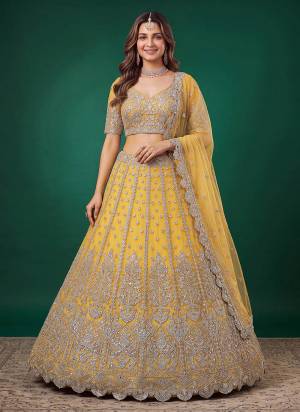 For A Designer Look,Grab These Lehenga Choli in Fine Colored.These Lehenga And Blouse Are Fabricated On Soft Net Pair With Dupatta Are Net.Its Beautified With Dori,Jari,Multyple Sequance Embroidery Work.