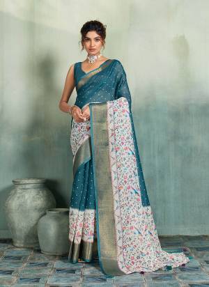 Garb This Party Wear Saree Paired With Blouse.This Saree Are Linen And Blouse Are Linen Fabric With Woven Jari Border Designer With Printed. Buy This Pretty Saree Now.