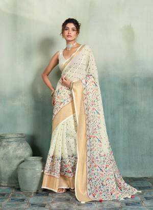 Garb This Party Wear Saree Paired With Blouse.This Saree Are Linen And Blouse Are Linen Fabric With Woven Jari Border Designer With Printed. Buy This Pretty Saree Now.