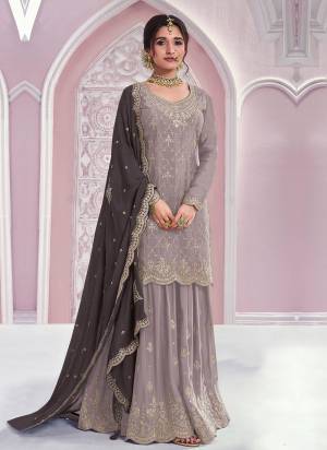 Garb These Fancy Designer Plazzo Suit in Fine Colored Pair With Bottom And Dupatta.These Top Are Chinon And Dupatta Are Fabricated On Chinon Pair With Chinon Bottom.Its Beautified With Santoon Inner.Its Beautified With Heavy Designer Embroidery Work.
