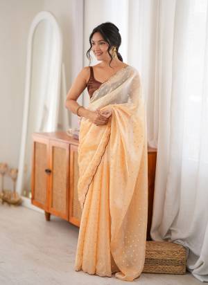 Looking These Fancy Party Wear Saree in Fine Two None Colored.These Saree Are Fendy Satin And Blouse is Ultra Satin Fabricated.Its Beautified With Two Tone Color With Woven Butti Designer,Beads Cut Dana Work.