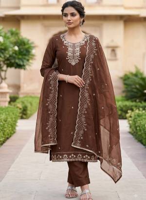 Looking These Suit in Fine Colored Pair With Bottom And Dupatta.These Top Are PV Chanderi And Dupatta Are Fabricated On Nazmin Pair With Rayon Bottom.Its Beautified With Designer Embroidery, Hand Work.