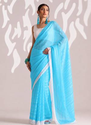Looking These Party Wear Ready To Wear Saree in Fine Colored.These Saree Are Chiffon And Blouse is Art Silk Fabricated.Its Beautified With Woven Lining Designer With Lace Border.