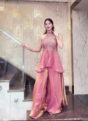 Garb These Suit in Fine Colored Pair With Bottom .These Top Are Fendy And Bottom Are Fabricated On Fendy Pair.Its Beautified With Designer Embroidery Work.