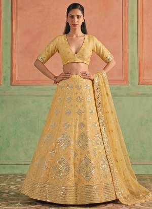 For A Designer Look,Grab These Lehenga Choli in Fine Colored.These Lehenga And Blouse Are Fabricated On Organza Pair With Soft Net Dupatta.Its Beautified With Designer Embroidery,Foil Mirror Work.