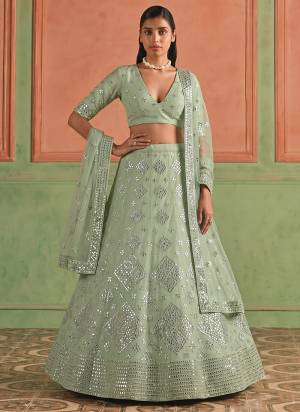 For A Designer Look,Grab These Lehenga Choli in Fine Colored.These Lehenga And Blouse Are Fabricated On Organza Pair With Soft Net Dupatta.Its Beautified With Designer Embroidery,Foil Mirror Work.