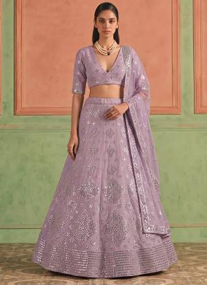 For A Designer Look,Grab These Lehenga Choli in Fine Colored.These Lehenga And Blouse Are Fabricated On Organza Pair With Soft Net Dupatta.Its Beautified With Designer Embroidery,Foil Mirror Work.